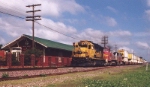 BNSF #8730 leading stack train past old Santa Fe depot